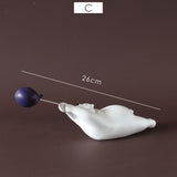 Escultura de Urso Polar com Balão Nanu